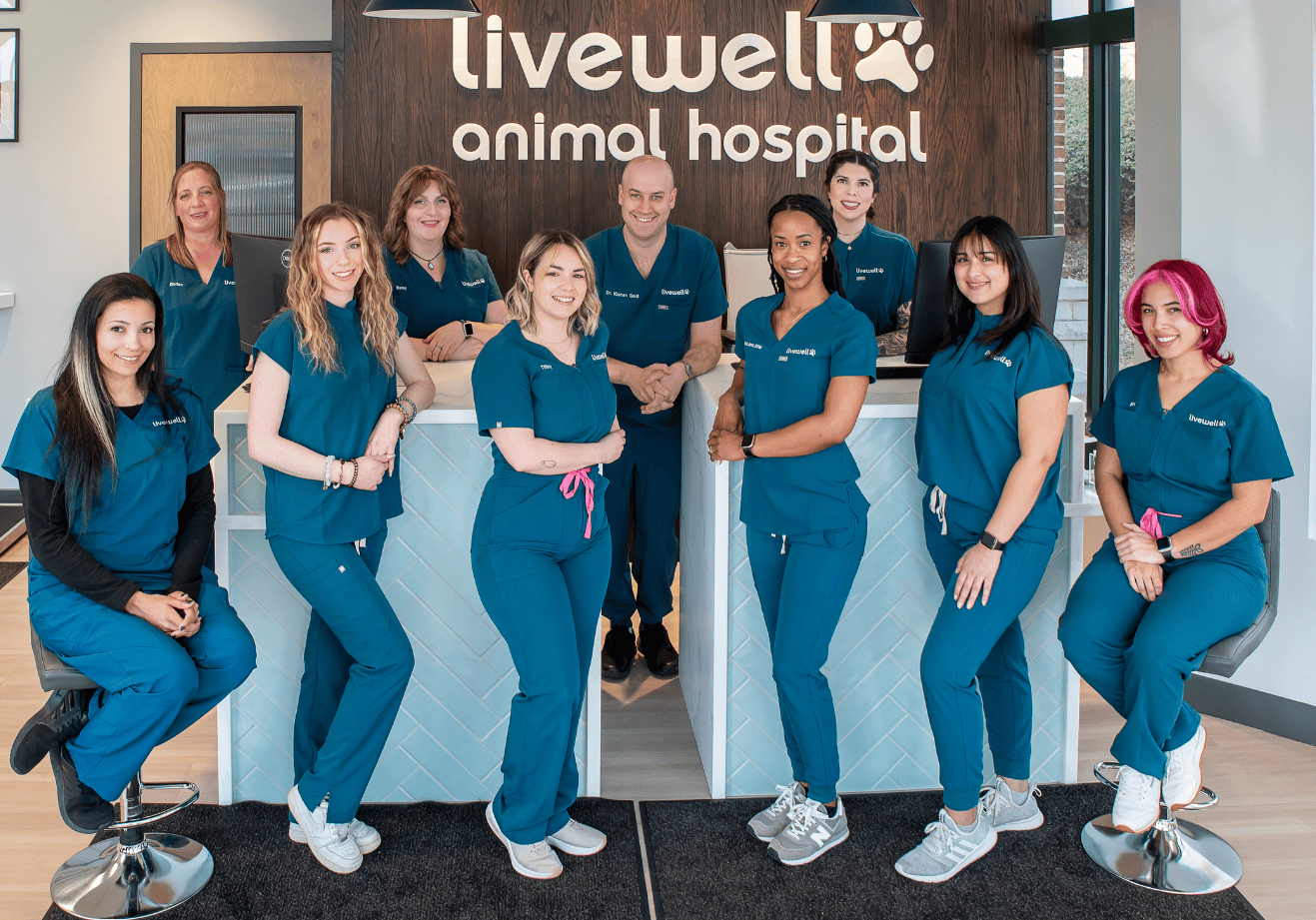 From left to right and back to front: Dorian, Betsy, Dr. Gold, Ashley, Dana, Faith, Tiffany, Dr. Jones, Gianna, and Brianna in front of receptionist area